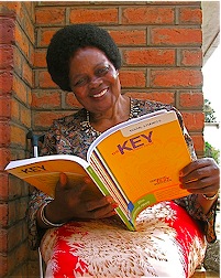 Cecilia Kadzamira look at donated book.